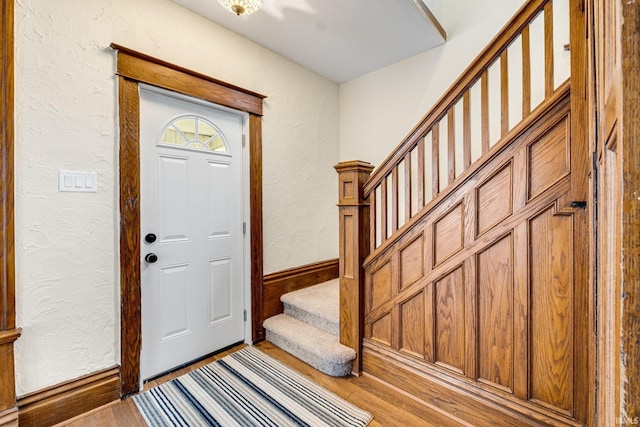 foyer entrance with light wood-type flooring