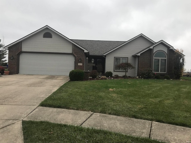 single story home featuring a garage and a front yard