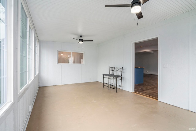 unfurnished room featuring concrete flooring and ceiling fan