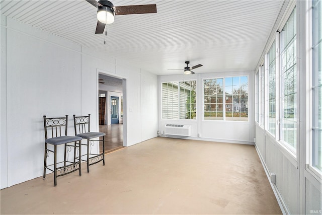 sunroom / solarium featuring a wall mounted air conditioner and ceiling fan