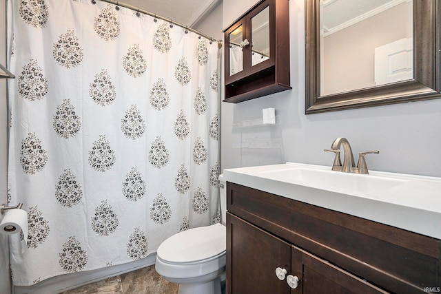 bathroom featuring vanity, toilet, and crown molding