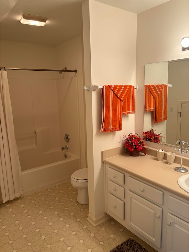 full bathroom with shower / tub combo with curtain, vanity, and toilet