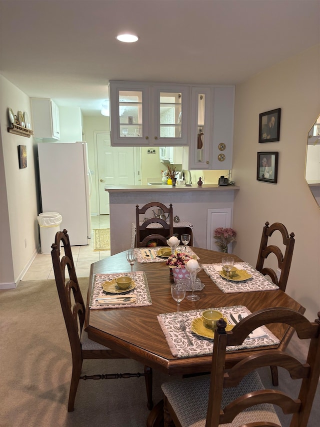 view of carpeted dining space