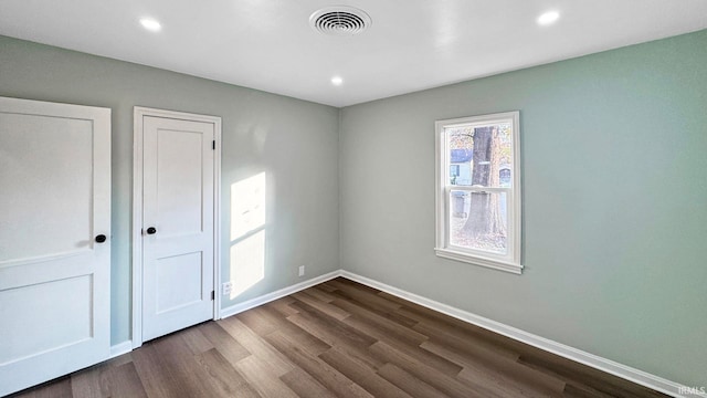 unfurnished bedroom featuring wood-type flooring