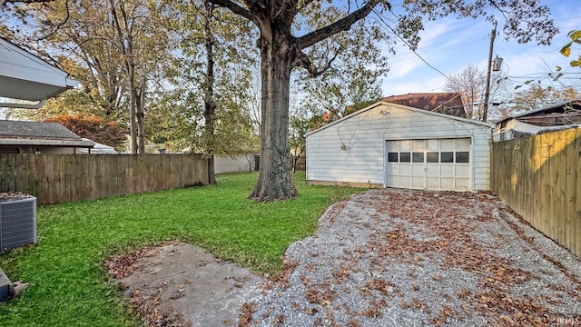 view of yard with central air condition unit, an outdoor structure, and a garage