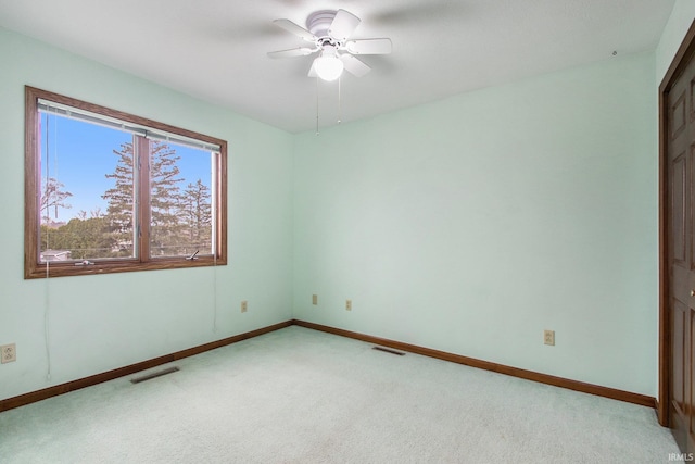 unfurnished bedroom with ceiling fan and light carpet