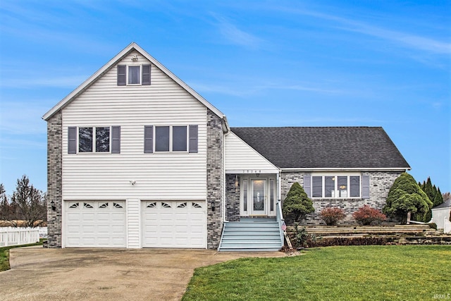 view of front facade with a front yard and a garage