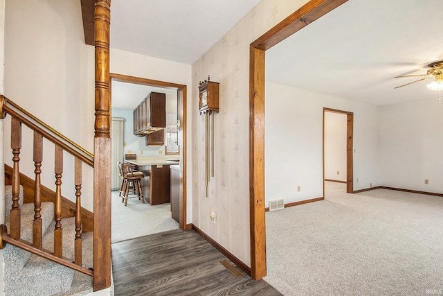 corridor featuring dark hardwood / wood-style flooring