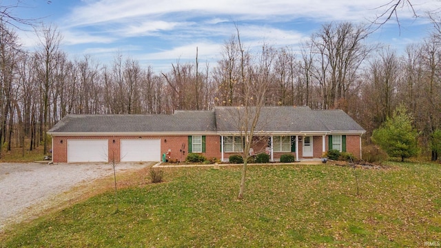 view of front of house featuring a garage and a front lawn