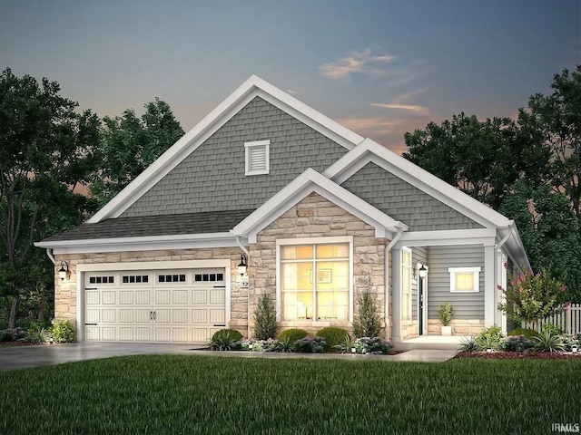 view of front facade featuring a garage and a lawn