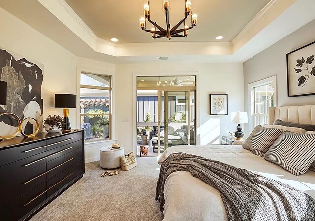 bedroom featuring access to outside, a raised ceiling, carpet flooring, and ornamental molding