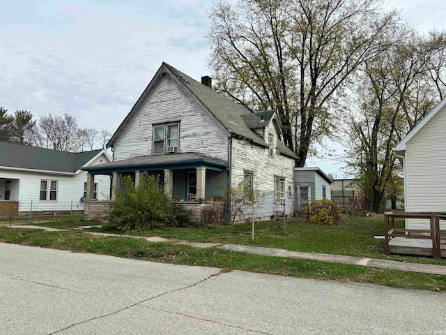 view of front of house with a front lawn and covered porch