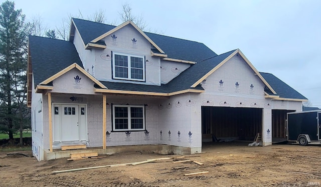 property in mid-construction with a porch and a garage