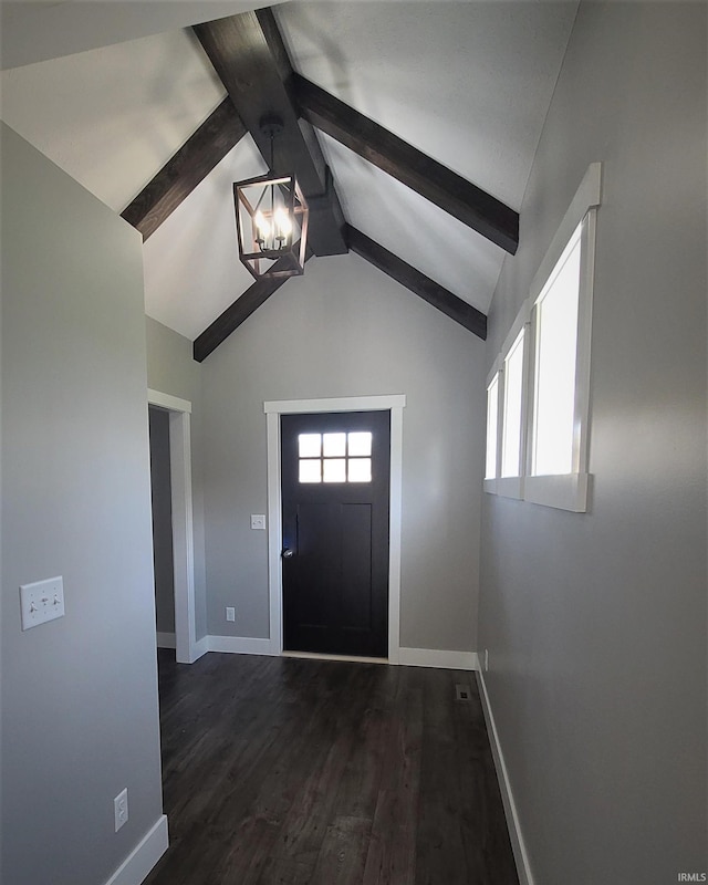 entrance foyer featuring vaulted ceiling with beams, dark hardwood / wood-style flooring, and a chandelier