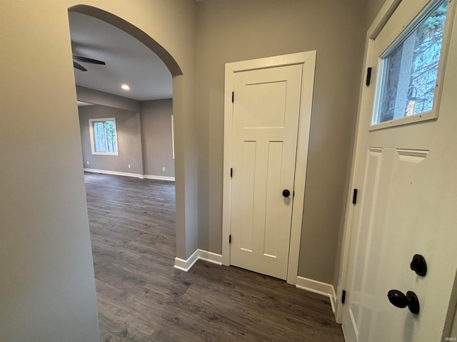 hall with dark wood-type flooring