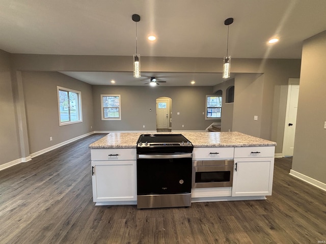 kitchen featuring a wealth of natural light, white cabinets, and stainless steel appliances