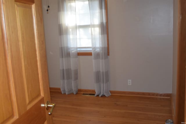 unfurnished room featuring light wood-type flooring