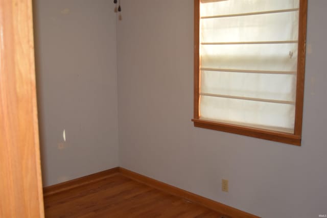 unfurnished room featuring hardwood / wood-style floors