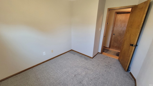 unfurnished bedroom featuring light colored carpet