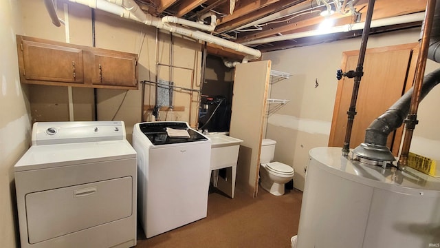 laundry room featuring washing machine and dryer and gas water heater