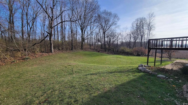 view of yard with a wooden deck