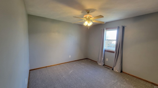 carpeted empty room with ceiling fan