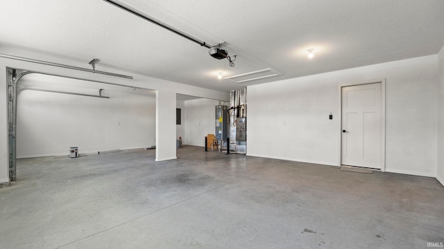 garage with a garage door opener and water heater