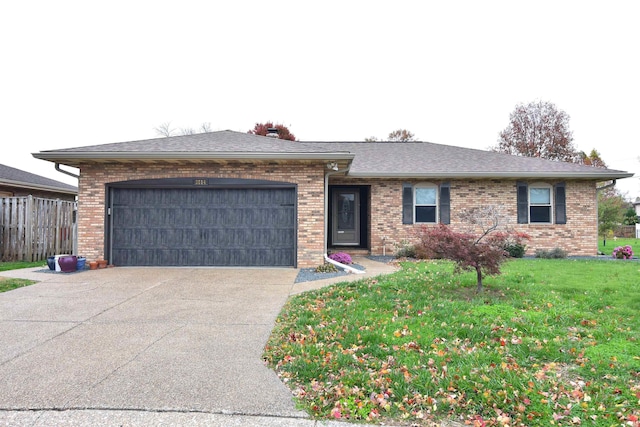 single story home with a front yard and a garage