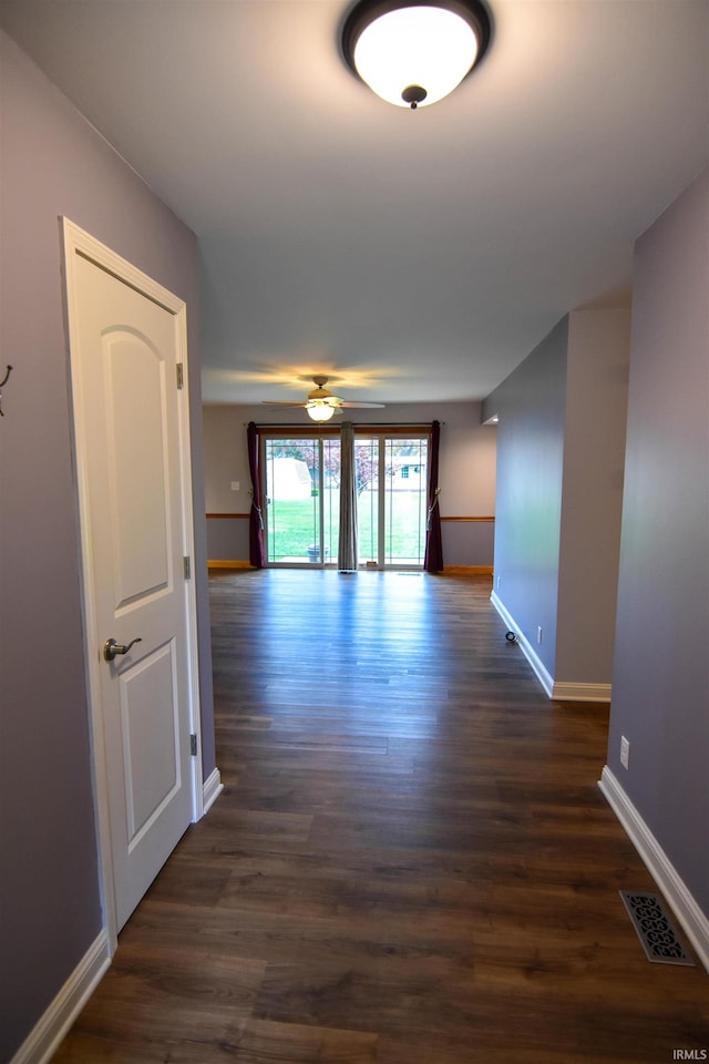 hall with dark hardwood / wood-style floors