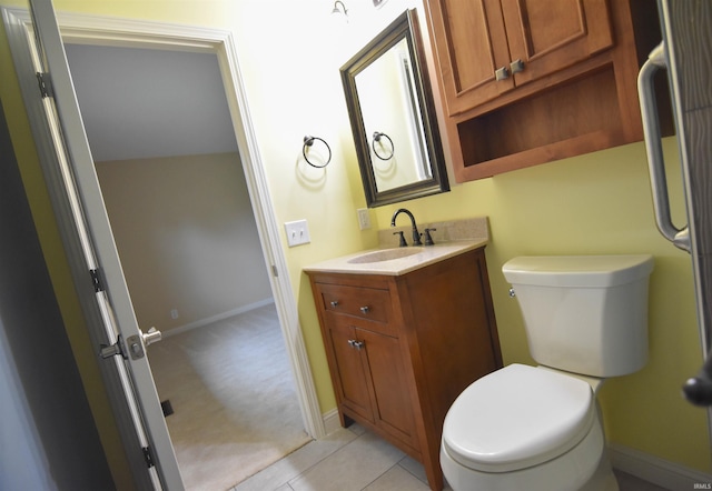 bathroom with tile patterned floors, vanity, and toilet