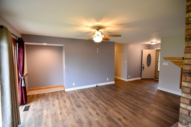 unfurnished living room with hardwood / wood-style floors and ceiling fan