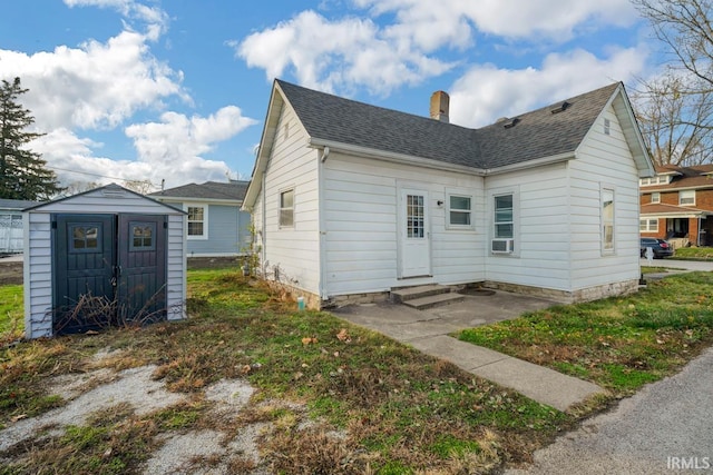 view of front of house featuring a storage shed