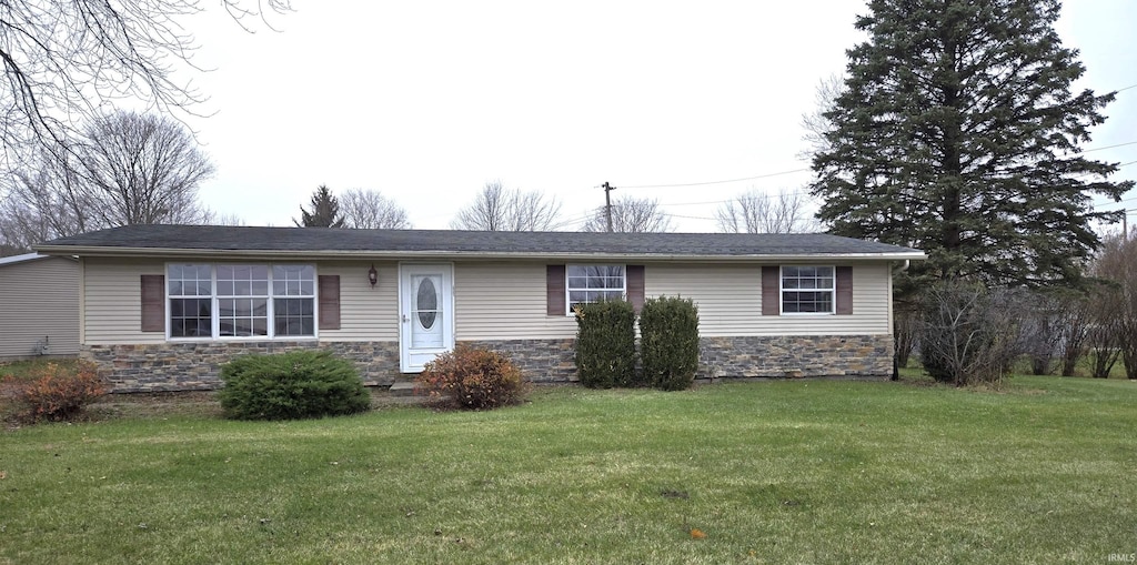 ranch-style house with a front lawn