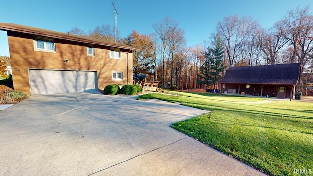 view of property exterior with a lawn and a garage