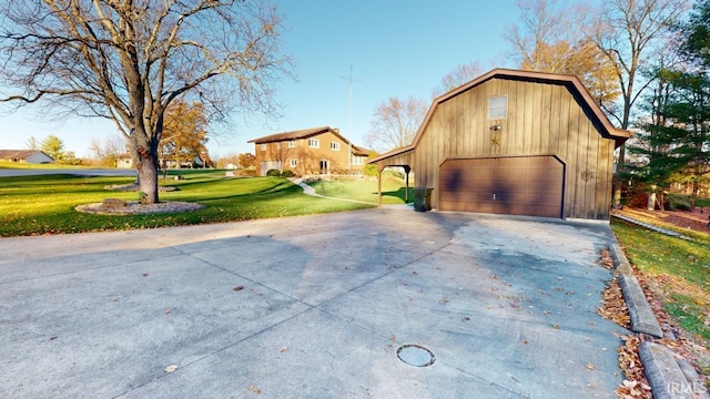 exterior space featuring a garage and a yard