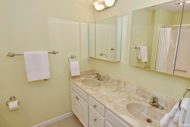 bathroom featuring tile patterned floors and vanity