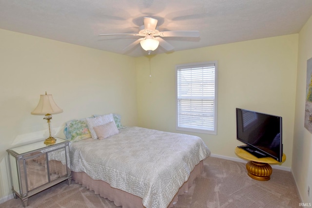 bedroom featuring ceiling fan and light colored carpet