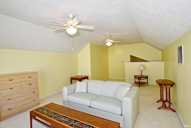 living room with a textured ceiling, light carpet, ceiling fan, and lofted ceiling