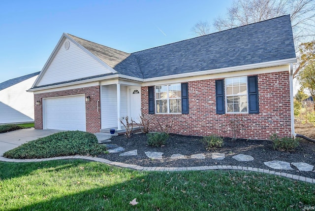 view of front of house with a garage and a front lawn