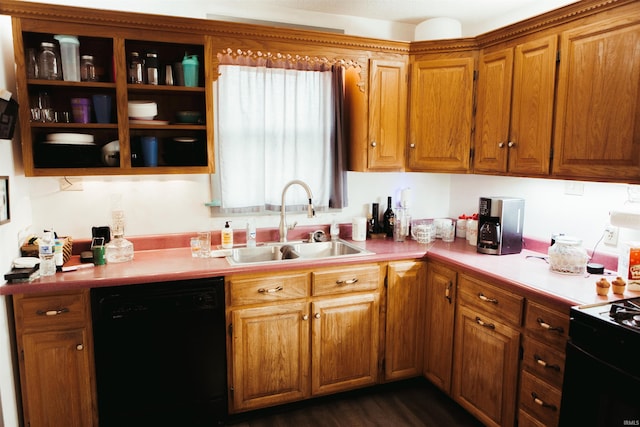 kitchen featuring sink, black appliances, and dark hardwood / wood-style floors