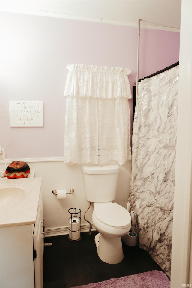 bathroom with vanity and toilet