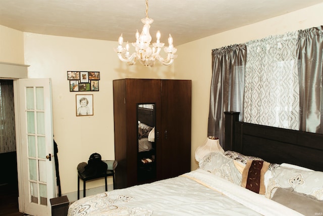 bedroom featuring an inviting chandelier