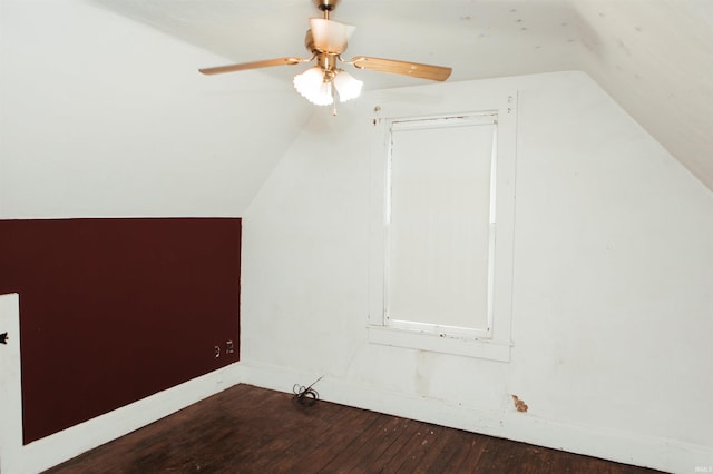 bonus room with ceiling fan, dark hardwood / wood-style floors, and lofted ceiling