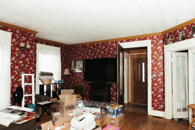 living room with dark hardwood / wood-style flooring and ornamental molding