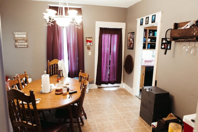 dining space featuring a notable chandelier