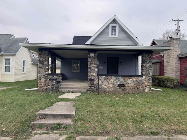 view of front of property with a front lawn and covered porch