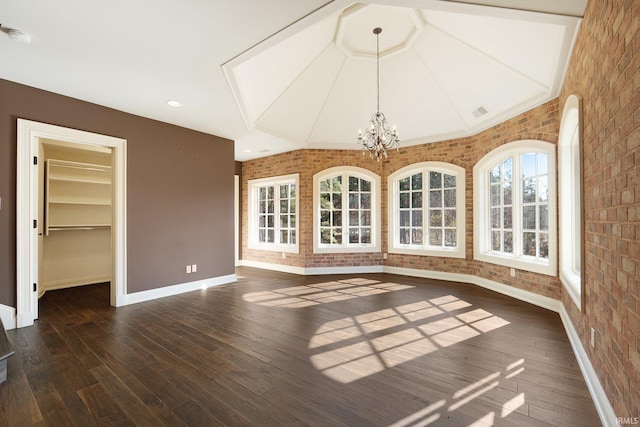 interior space with lofted ceiling and a chandelier