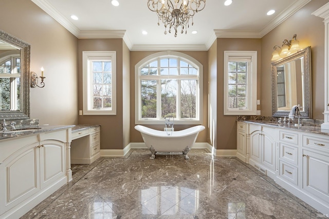 bathroom featuring a washtub, vanity, a chandelier, and crown molding