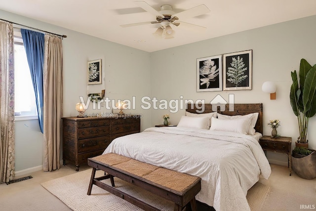 bedroom with ceiling fan and light carpet