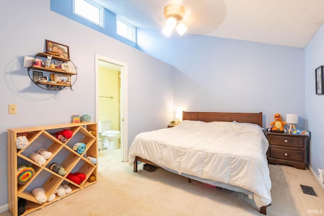 bedroom featuring ceiling fan, ensuite bathroom, and carpet floors